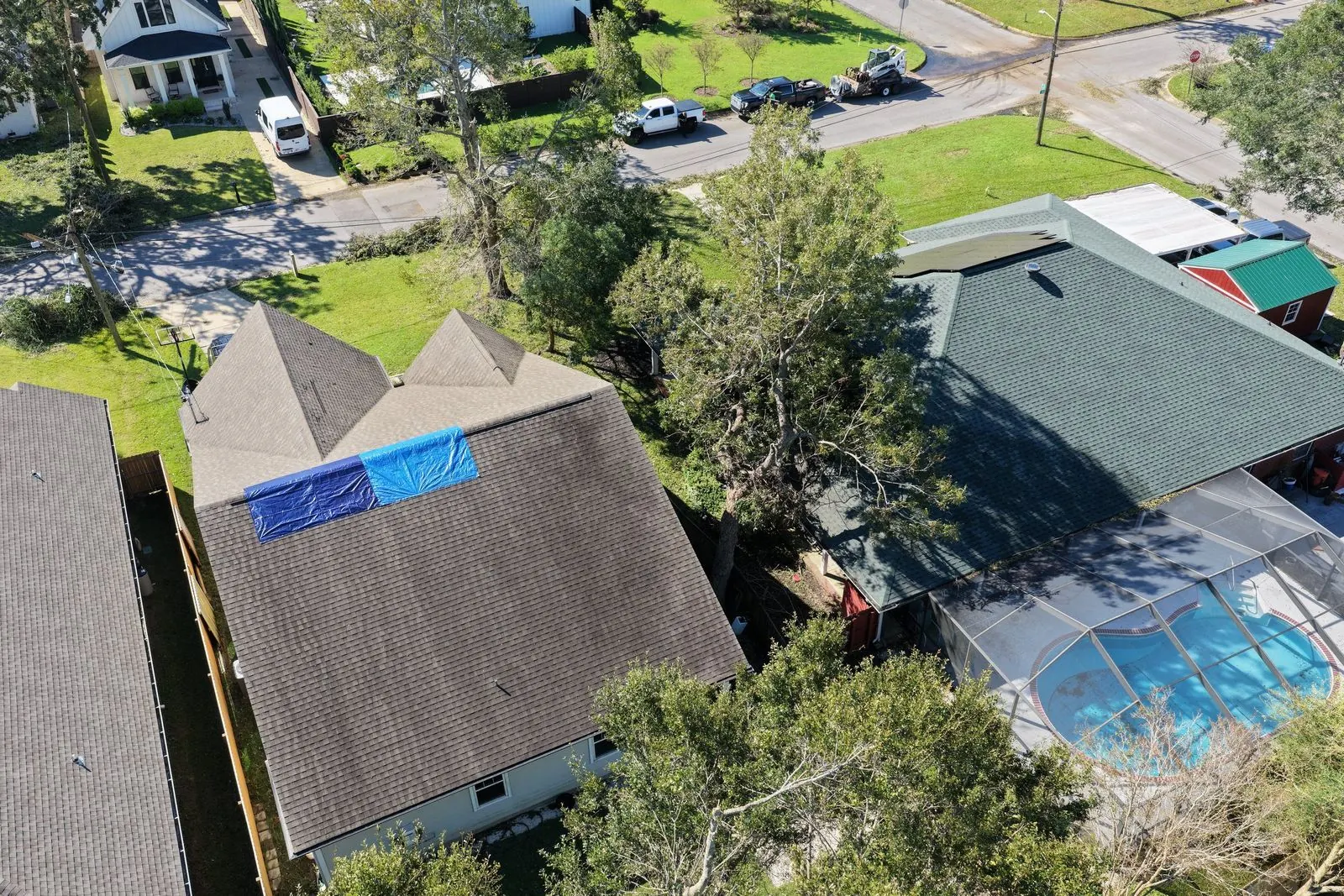 Aerial photo of a tarped roof after a storm