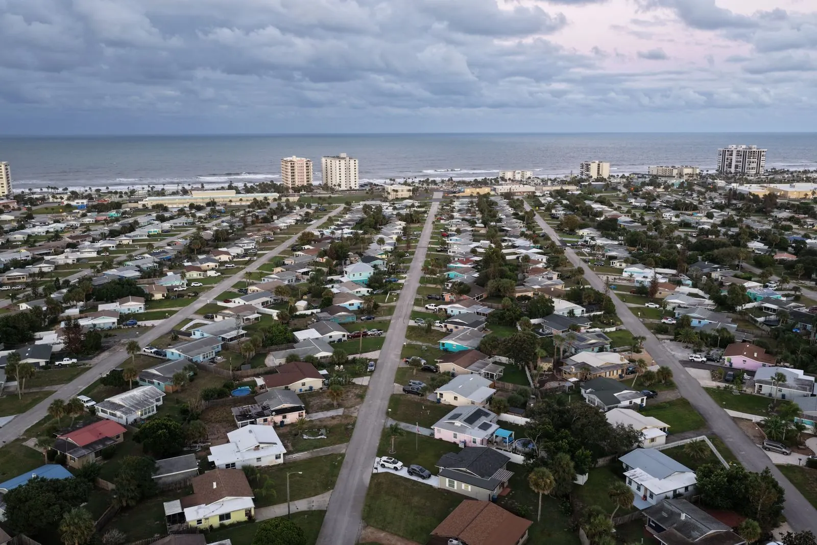 Aerial of a coastal neighborhood between the ocean and the river